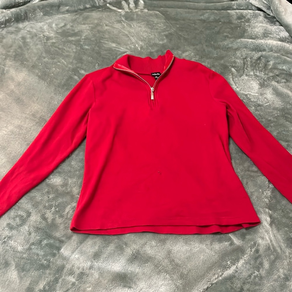 Red zip up long sleeve .